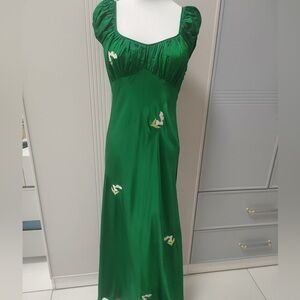 Elegant Green Silk Evening Gown with Floral Accents